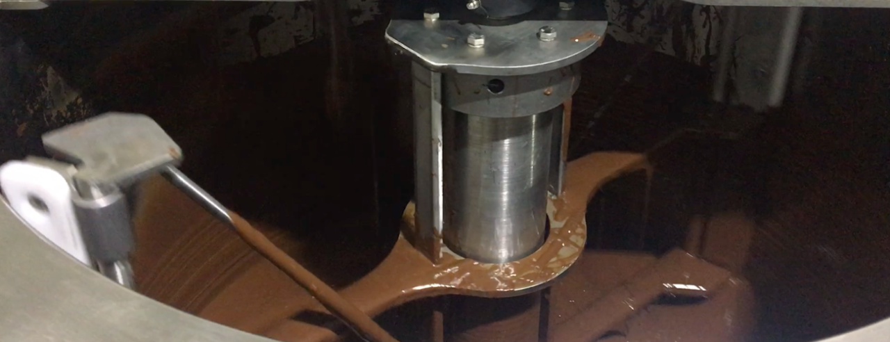 The efficient agitator in Betec's melting tank, equipped with side and bottom scrapers, facilitates a quick and uniform melting process, enabling effortless production of liquid chocolate.